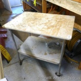 Nice rolling cart with shelf is about 3