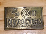 Brass toned Colt Revolver belt buckle measures approx. 2-1/4