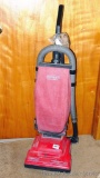 Crosley upright vacuum cleaner with a few attachments and extra belt and bags. Powers up.