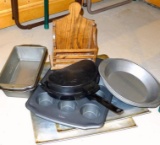 Two Air-Bake cookie sheets, egg poacher, bread and cake pans.
