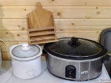 West Bend The Crockery Cooker and a smaller crock pot/slow cooker, plus a handmade napkin holder.