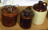 Stoneware jug marked USA, two stoneware pots with lids. Jug is about 7