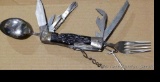 Really cool camp knife includes fork, spoon, corkscrew, knife, scissors, more. Roughly 4-3/4