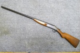 Scout top break shotgun. Action locks up tight. Butt stock is loose on rear tang, has an old crack