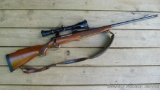 Remington Model 700 bolt action rifle in 7mm Rem Mag. Comes with a muzzle brake, 3-12 scope with