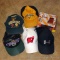 Green Bay Packer, Callaway, Bucky Badger, and Under Armour caps; new in package Forearm Forklift.