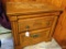 Two drawer night stand matches dresser in lot 222. Measures 26