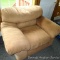 Overstuffed arm chair matches couch in lot 254. Upholstery is in overall good condition, has a