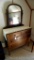 Antique four drawer dresser with swiveling mirror is sturdy and in overall good shape. Drawers have