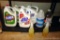 Two mostly full bottles of Clorox bleach and 409 all-purpose cleaner, Tilex daily shower cleaner,