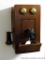 Neat old telephone cabinet has been made to hide a wall phone. Cabinet measures 14-1/2
