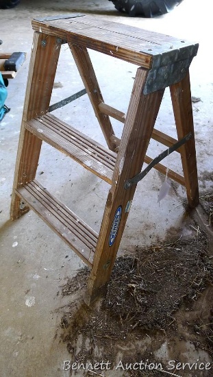 Two foot wooden step ladder rated for 200 lbs.