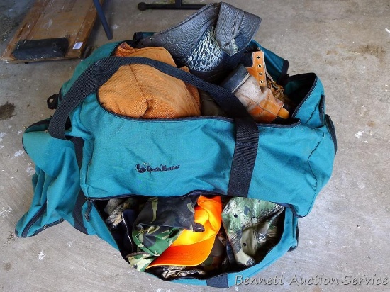 Huge duffle bag is approx. 36" x 18" x 16" filled with hats, coats, boots, camo clothing and more.