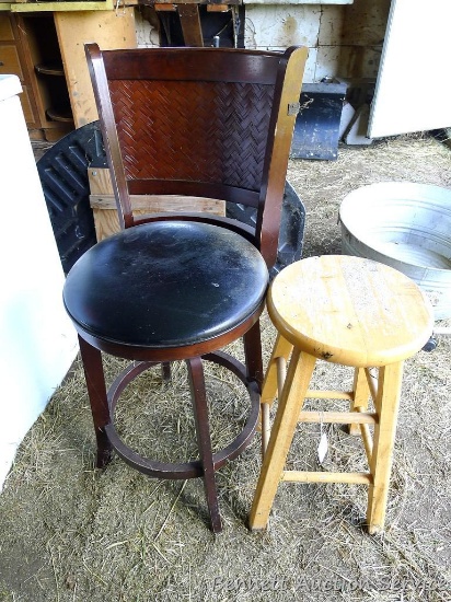 Two shop stools each have a seat that is about 2' high. Sturdy stools.