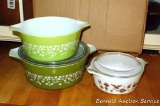 Vintage Pyrex green daisy casserole dishes, larger is 2-1/2 quart; other smaller Pyrex baking dish