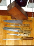 Wooden knife block with a few Chicago Cutlery knives and a couple of others.