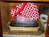 Glass bakeware including 10x15, 11x7, loaf pans, casserole carrier, more.