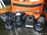Vintage Ricoh A-100 35 mm film camera with additional lenses, filters, manuals, flash, case, more.