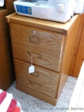 Two drawer filing cabinet and some hanging files. Cabinet measures 27