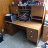 Home office desk is sturdy. Two drawers and door below for storage. Measures 5' wide x 4-1/2' tall x
