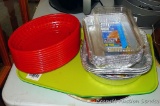 Four plastic trays, a dozen red plastic serving baskets are each 9