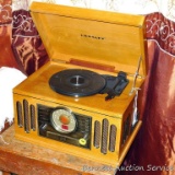 Reproduction Crosley radio with turntable & CD player. Powers up and disc drawer opens. Cabinet