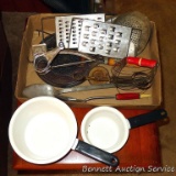Vintage kitchen utensils including graters, beater, pastry blender, flame spreader, plus two cute