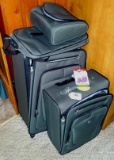 Four piece American Tourister Spinner luggage set is in good condition. Largest piece still has