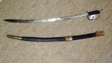 Indian sword is approx 3' long. Handle is a little loose, otherwise in good condition. Scabbard is