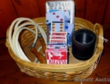Heavy duty woven basket comes with decks of cards, a dice cup, jump rope, dominoes. Basket is 13