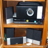 RCA DVD Home Theater system with six speakers, player and remote. Powers up.
