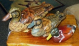 Three decorative wooden ducks, largest is 12
