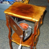 Antique smoking stand has an ashtray, matchbox holder and cutter hidden inside door. Stand is 26