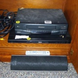 RCA DVD player, tray opens when button is pushed; Magnavox VHS player, turns on; Pioneer speaker.