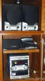 Philips Magnavox stereo with tuner, CD changer, cassette player and five speakers. Powers up, radio