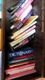 Shelf full of books including How to Make Cowboy Horse Gear; Stocking Up III; more.