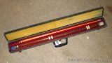 Two-pieces pool cue comes with a hard case. Wooden cue has carves portions near bottom of handle.