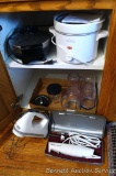 Oster waffle iron, Rival 2 qt slow cooker, KitchenAid hand mixer, Hamilton Beach electric knife,