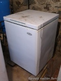 Woods chest freezer is currently plugged in and working. Stands 34