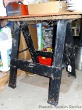 Pair of steel sawhorses with wood on top, stand 30