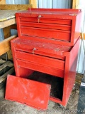 Two section metal tool cabinet. Top section is 12