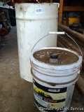 Approx. 1-1/2 gallon Case IH Hy-Tran Ultra oil; plastic barrel is 25