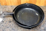 Two cast iron skillets. Larger is 12