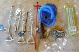 Coleman tent stakes NIP; foot pump; ratchet strap; tie out stakes for small animals.