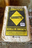 Two 60 lb. bags of High Strength Sakrete concrete mix.