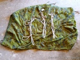 Camo quilted horse poncho; 3 rope halters, one is labeled 'yearling cotton, made by Fabtron Inc.'