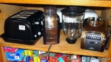 Sunbeam four slice toaster; Krups coffee grinder; Oster 14 speed blender with 8 cup glass pitcher;