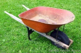 Decent wheelbarrow. Tire and tub seem good. Wood is weathered, but sound.