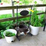 Decorative wrought iron plant stand is 3' tall; also two other planters and a cast iron pot.