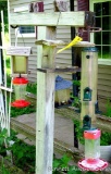 Hummingbird, thistle and other feeders as pictured.